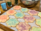 Photo of light pink, light blue, light green & lavender sprinkled flower cookies. Available in Berkeley.