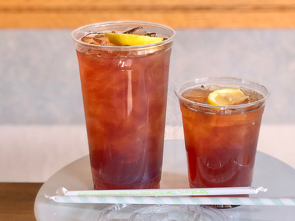 Iced Tea; two glasses one 32 ounces and the second is 16 ounces, each with a slice of lemon. Available in El Cerrito.